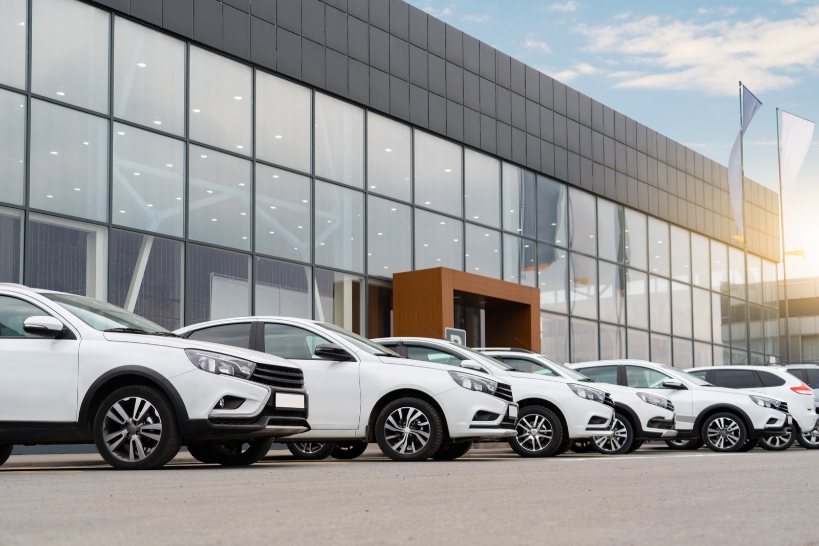 SUV lineup outside a dealership showroom